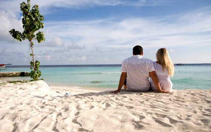 Couple enjoying the waves at Goa Beach